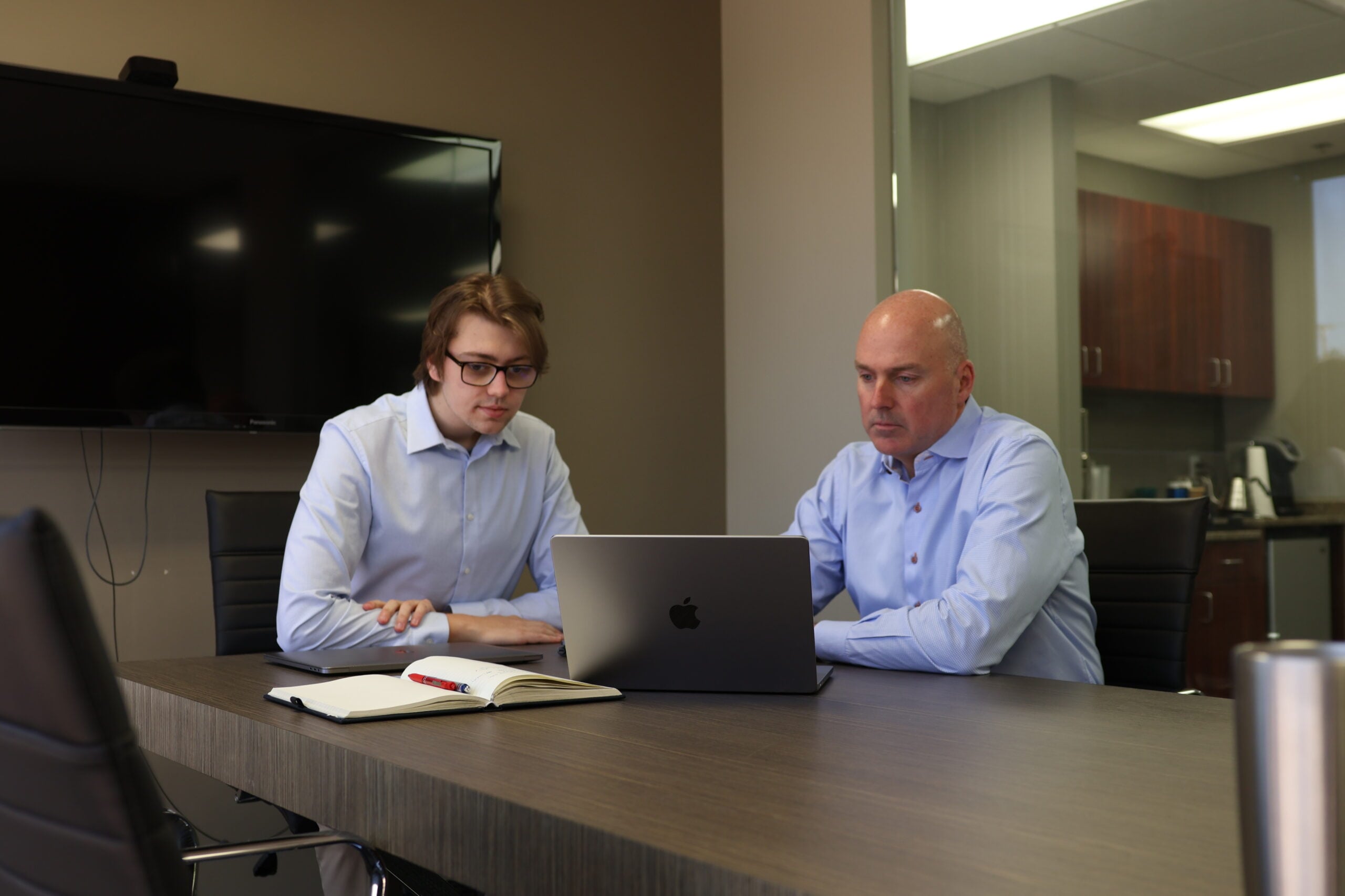 Money Evolution planning team reviewing a retirement plan
